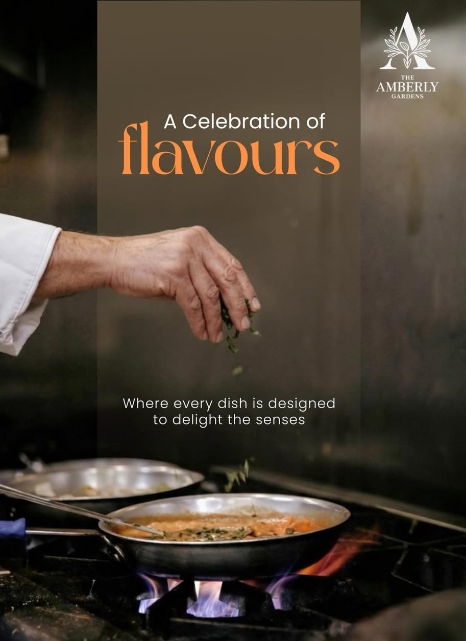 Fine dining at The Amber Garden — candlelit table with gourmet cuisine